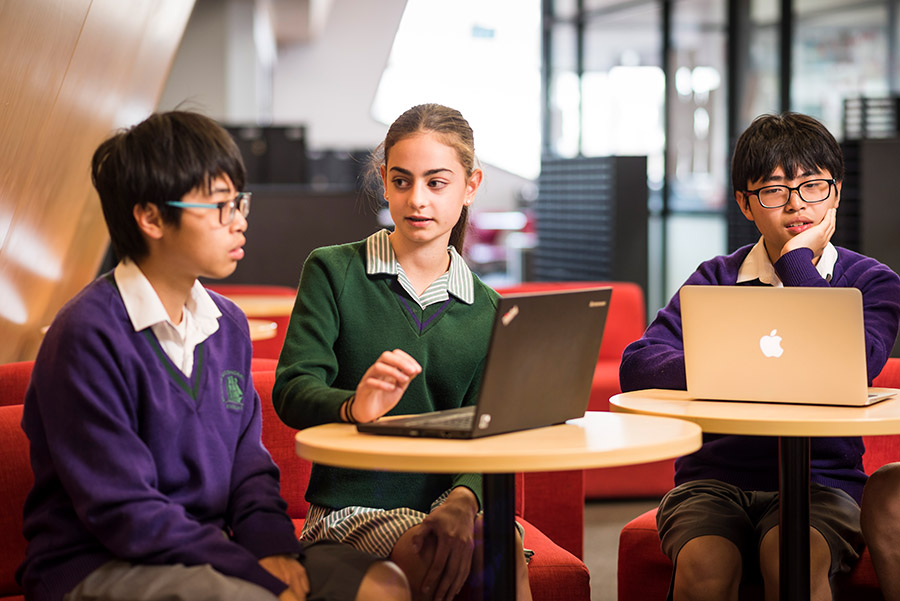 School kids working on laptops