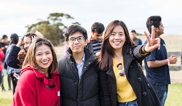 Three smiling students