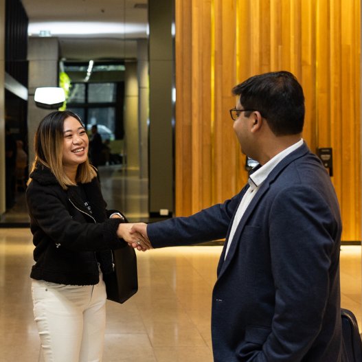 Student shaking hands after business meeting