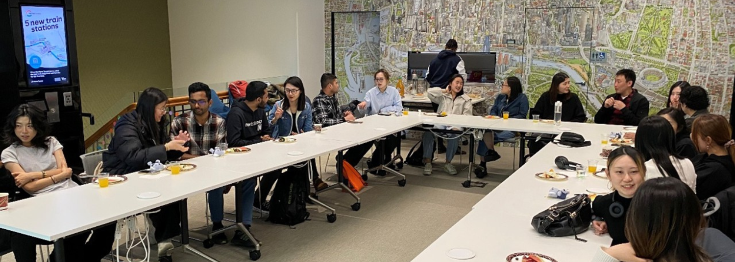 Two students and a lifeguard at the beach.