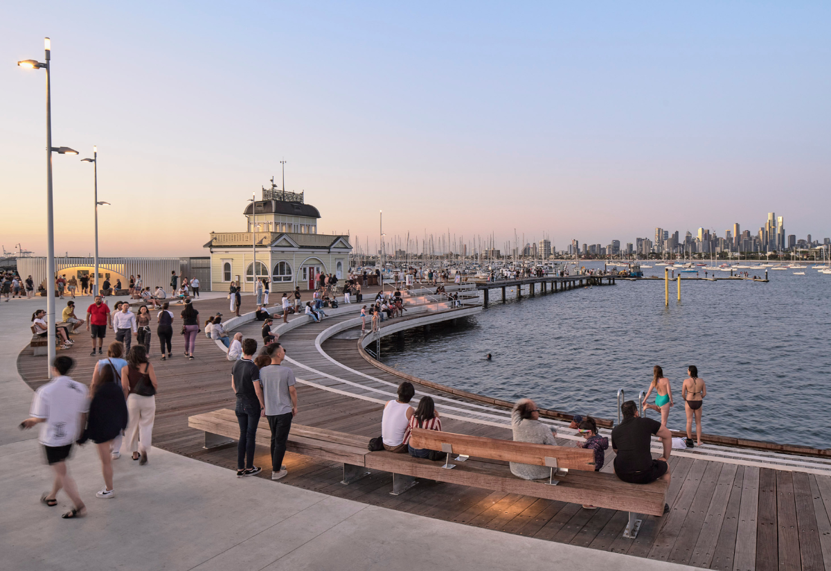 A group of people along St Kilda Pier