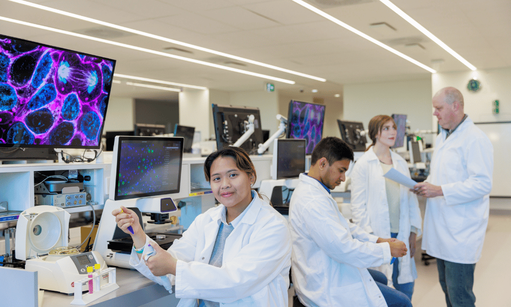 People in lab coats in a lab
