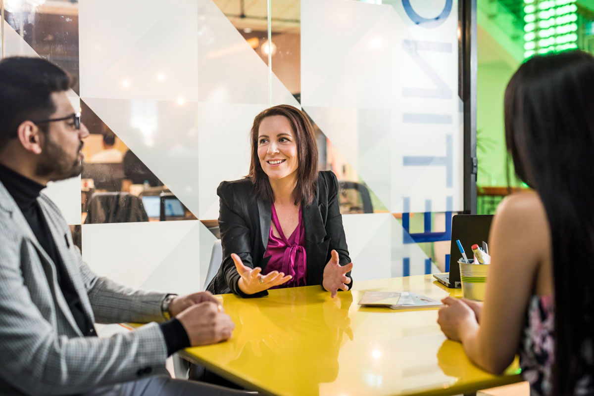 Three people in a meeting