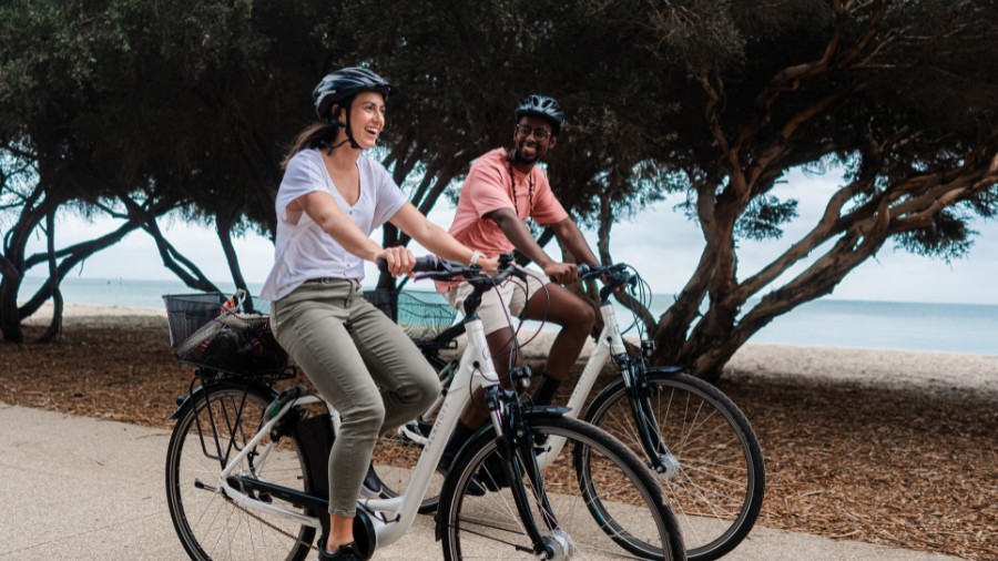 Two international students riding along the bay