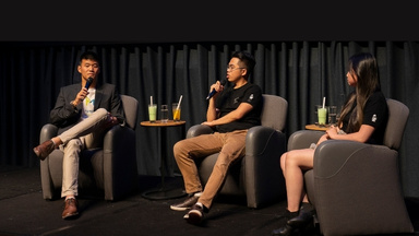 Panel at pitch competition, Study Melbourne and Startspace: Powered by State Library Victoria logos on screen