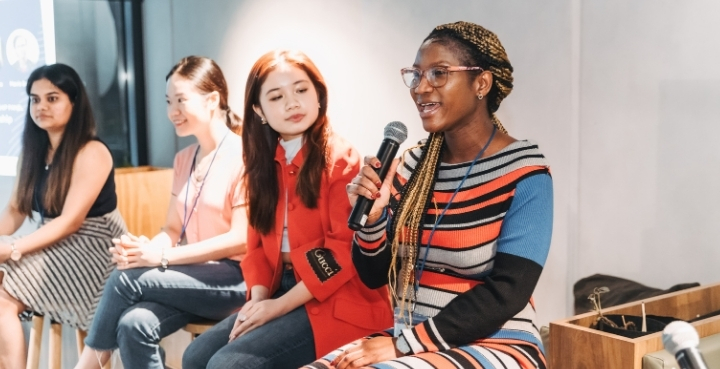 Four students on group panel at networking event