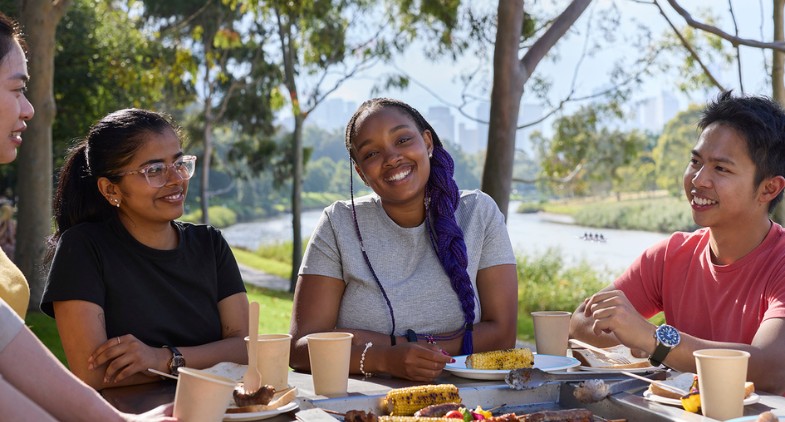 Students gathered on the banks of the Yarra river