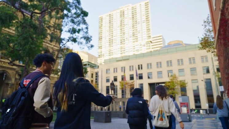 Students on campus, enjoying the trees and gardens