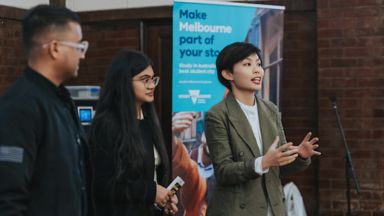 Students with speaker at leadership event