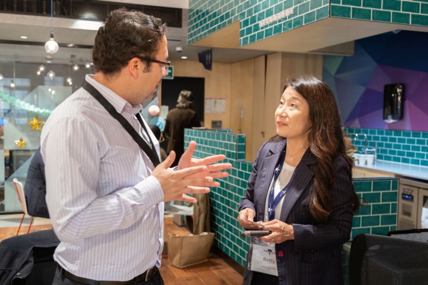 Two people collaborating at a conference