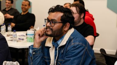 International students listening to speaker at conference