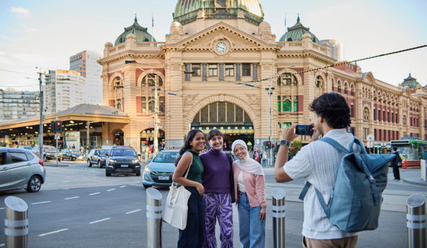 A person taking a picture of a group of people