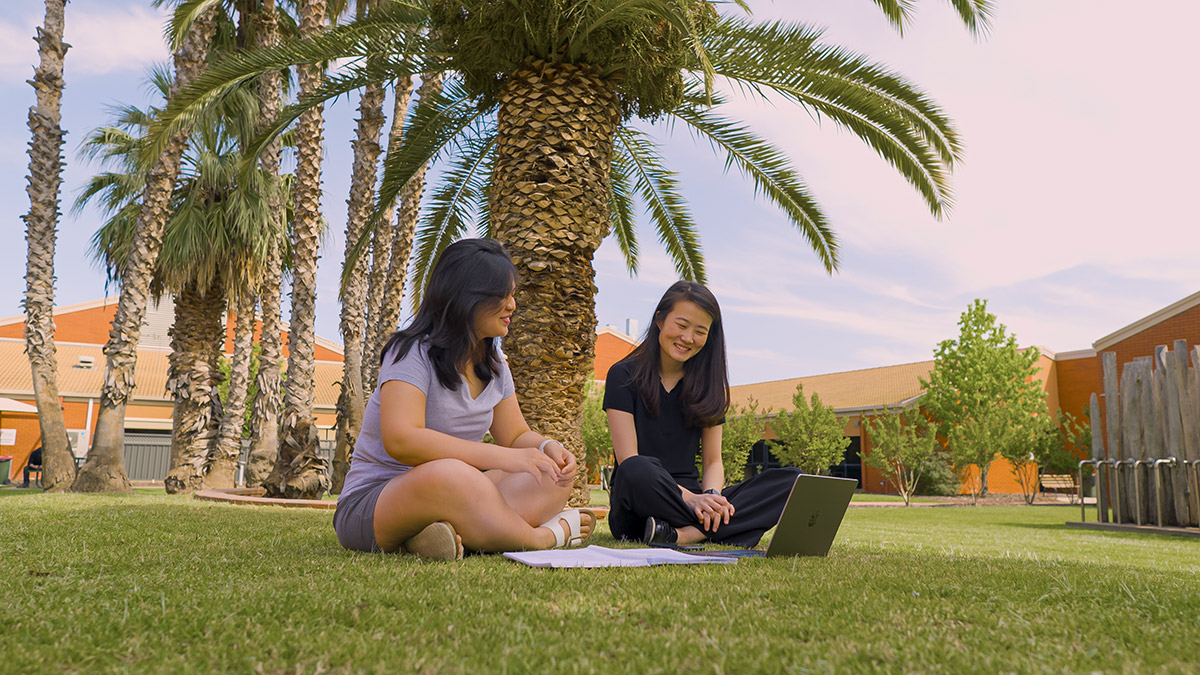 Students sitting on lawn