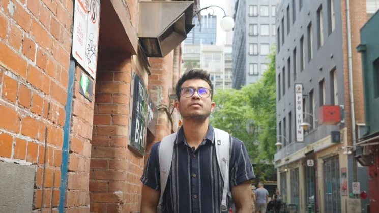 Student exploring Melbourne's laneways with backpack