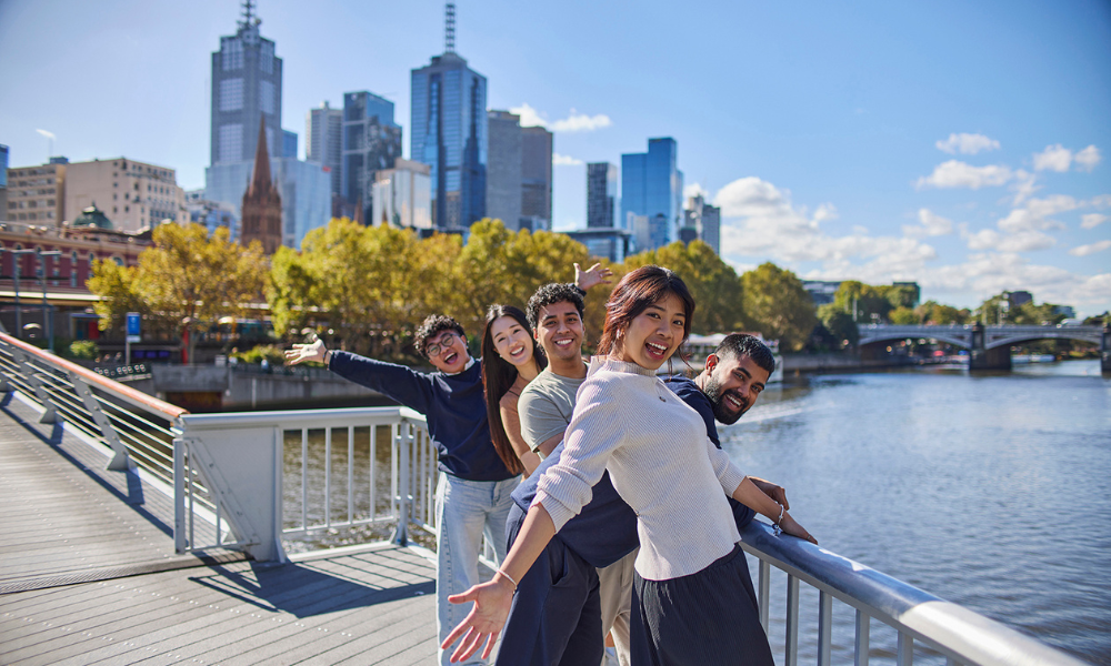 A group photo on a bridge