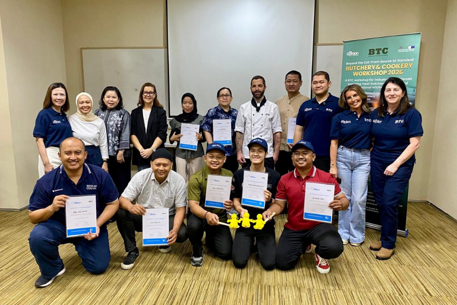 Photograph of a group of people holding certificates 