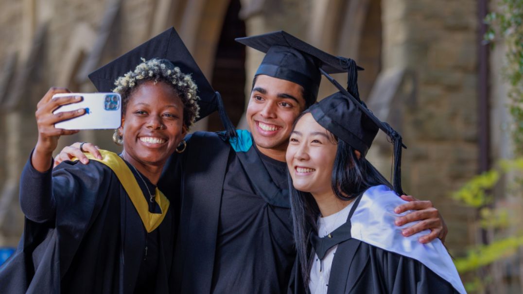 Melbourne graduates posing for a photo