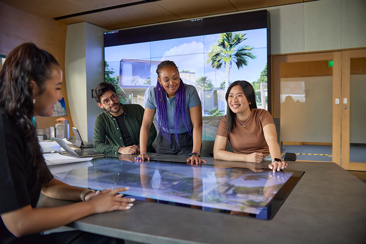 Students working over a table screen