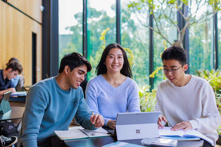 Three students studying 