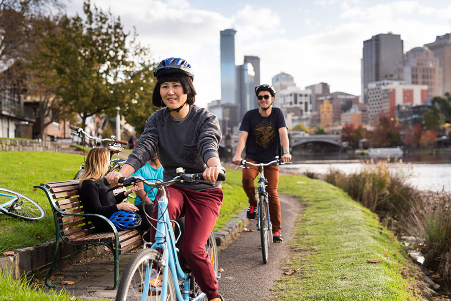 Riding bikes along the riverbank