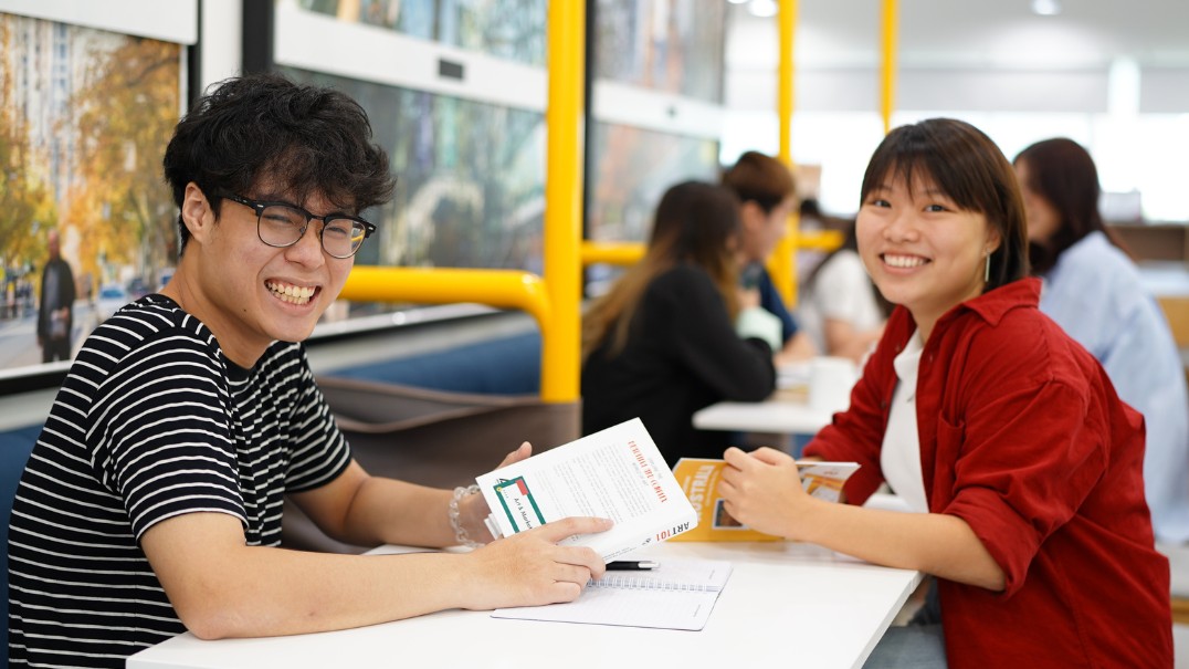 Two people collaborating at a conference