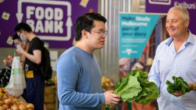 Student shopping for fresh fruit and vegetables