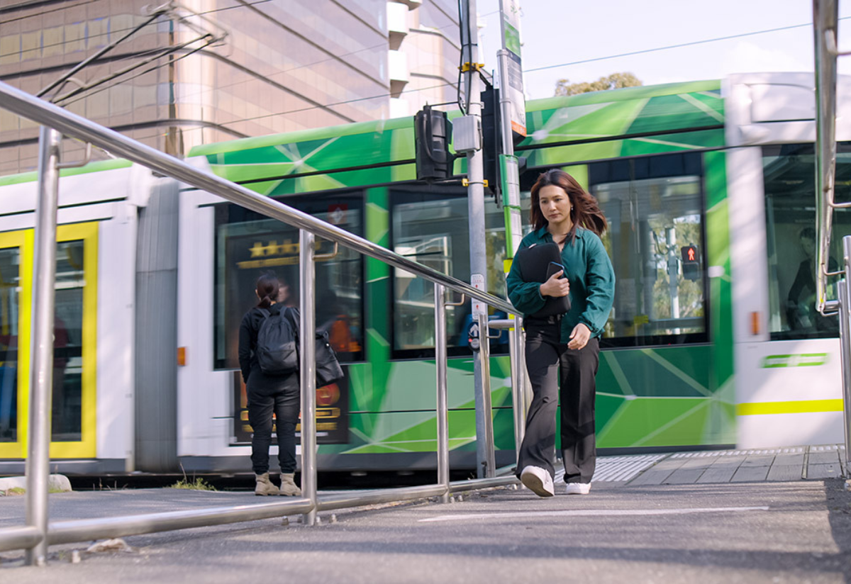 Students sitting and standing on the river bank