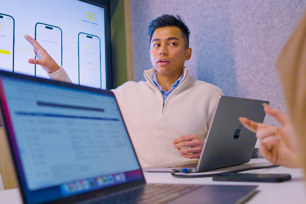 he screen features three smartphone mockups with user interface elements in white, blue, and yellow, highlighting app layout and navigation flow.