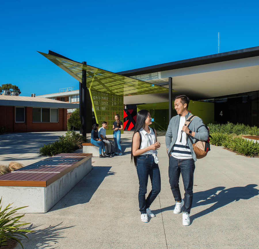 Building with 2 students walking 
