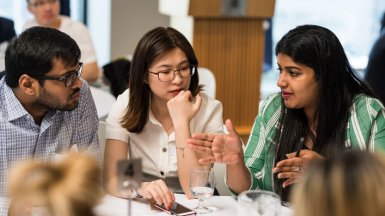 Three students in discussion