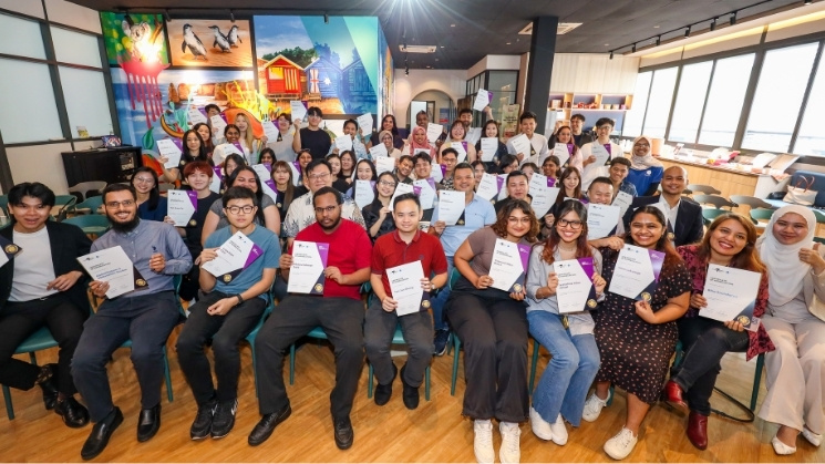 Group photo of participants holding certificates