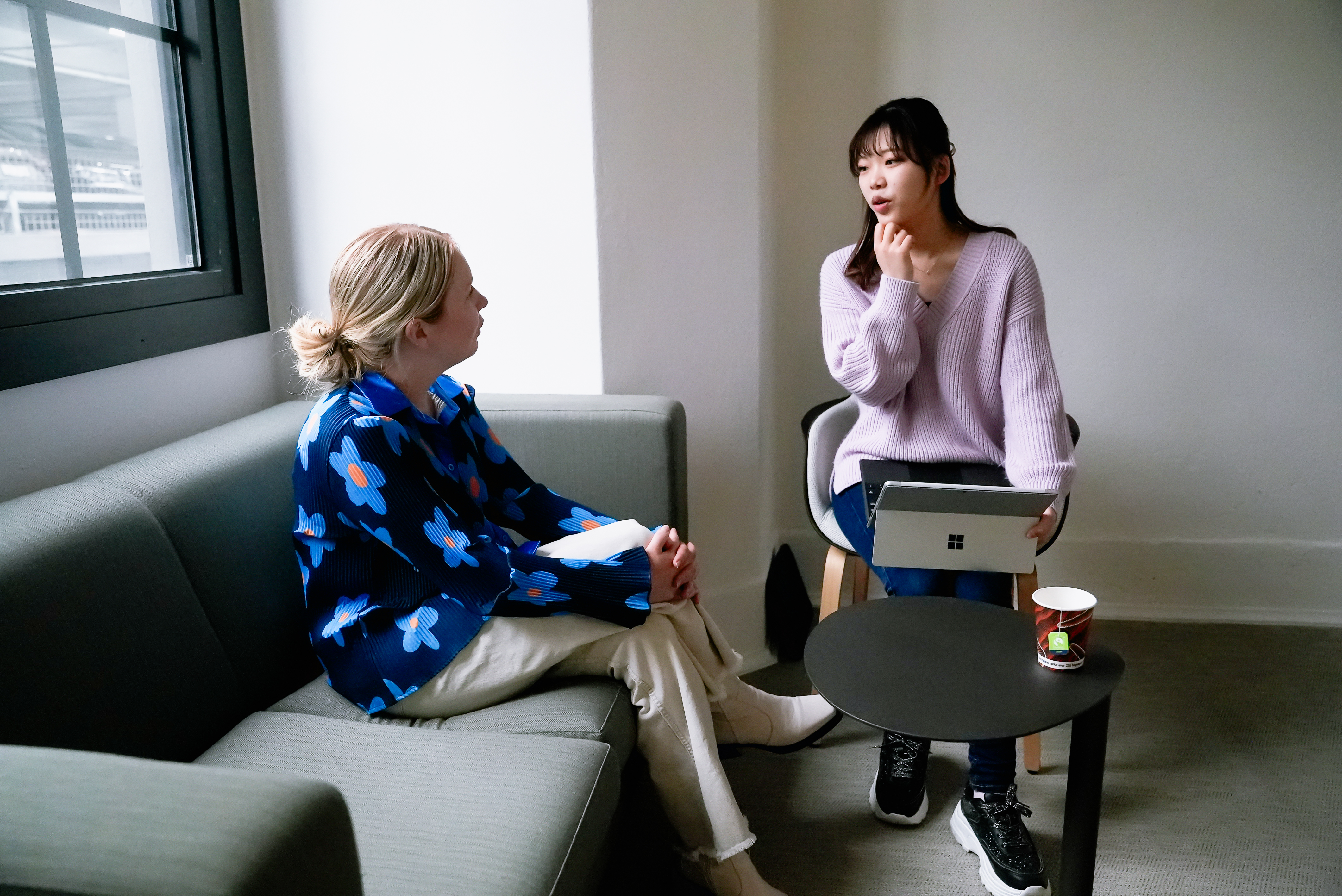 Two people talking seated