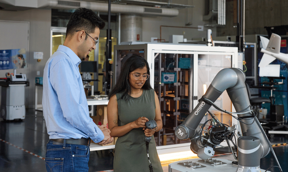 Two people interacting with a device