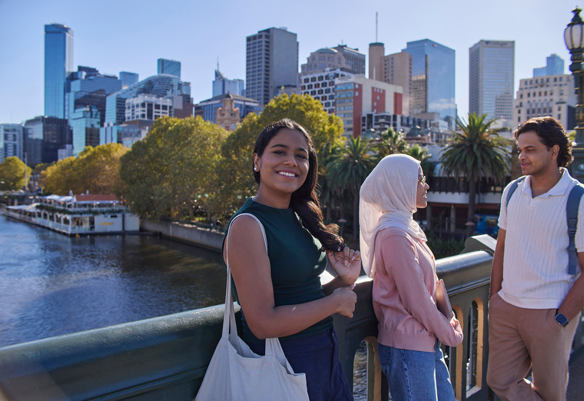 A group of students near a bridge 