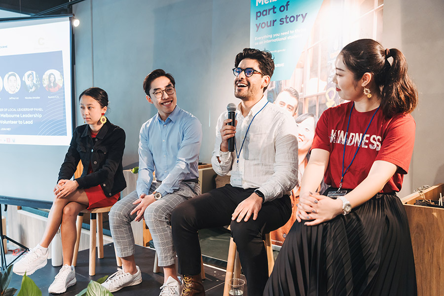 Panel speakers during conference answering questions