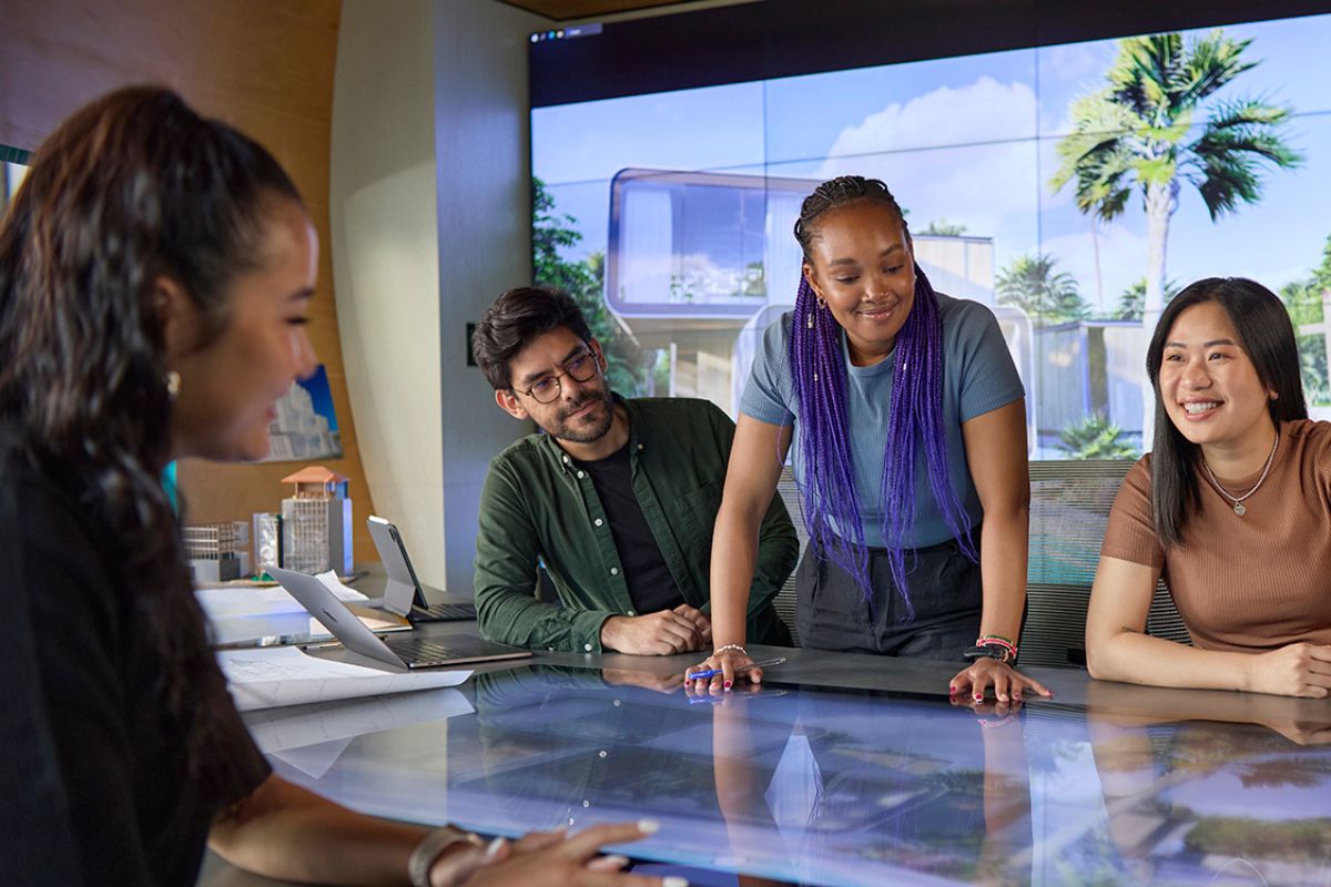 Graduate students collaborating in a work meeting room